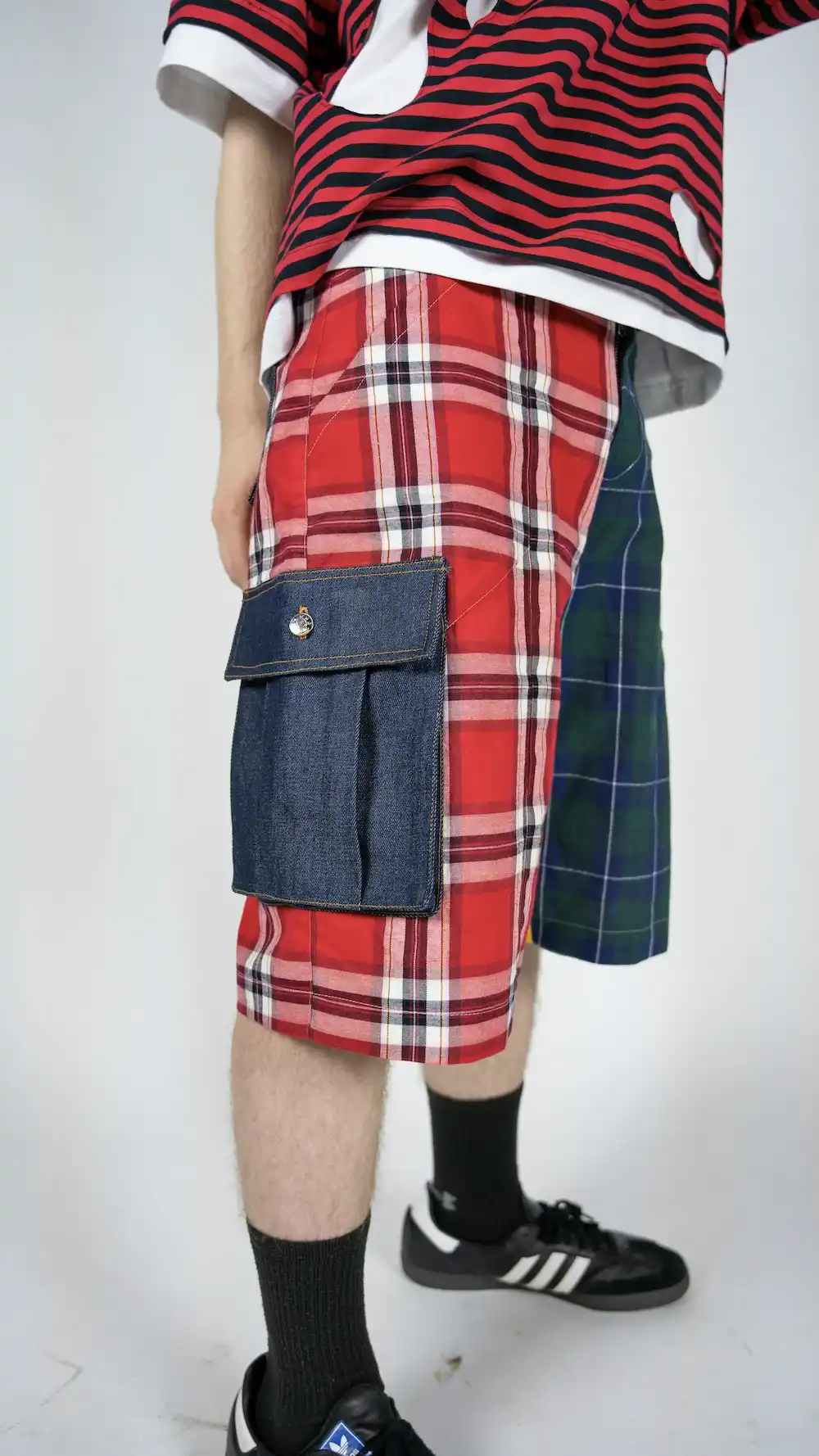 Male model wearing TRKSTR Baggy Check Cargo Shorts